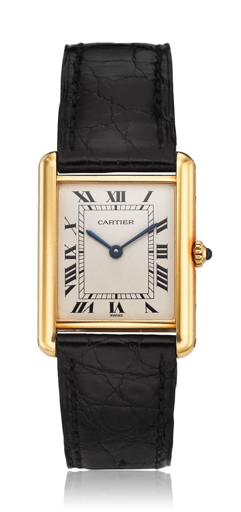 cartier 18k gold tank watch.